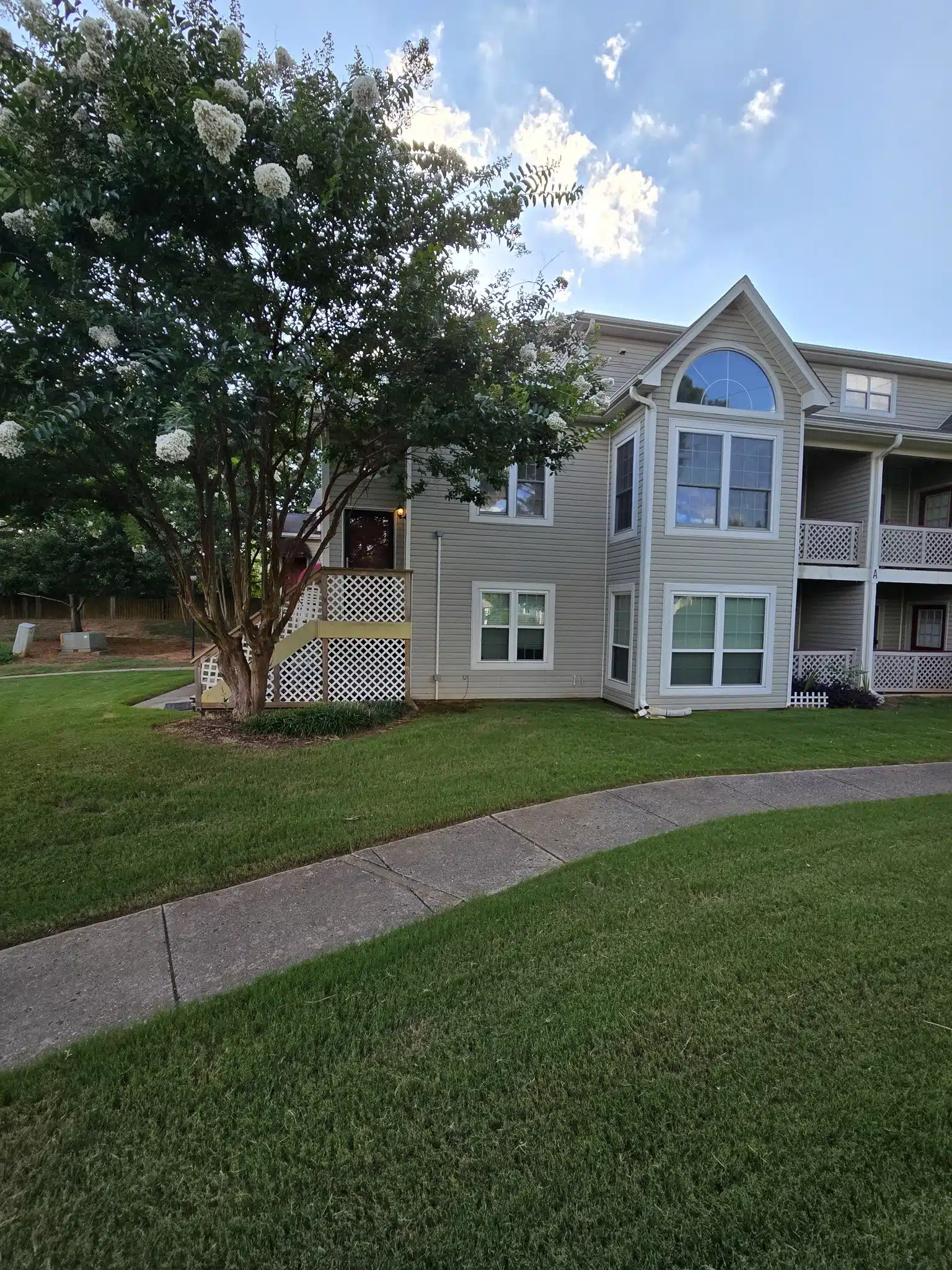 Apartment building with green lawn